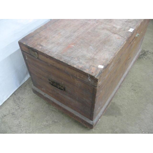 403 - Pine blanket box, the hinged lift top lid opening to a candle box and storage with iron carrying han... 