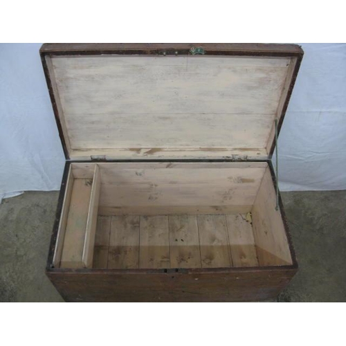 403 - Pine blanket box, the hinged lift top lid opening to a candle box and storage with iron carrying han... 