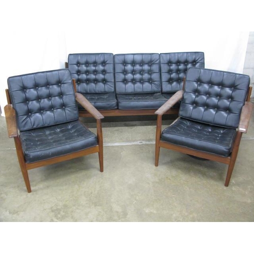 405 - Mid century Danish three piece suite in the manner of Arne Vodder having leather cushioned buttoned ... 