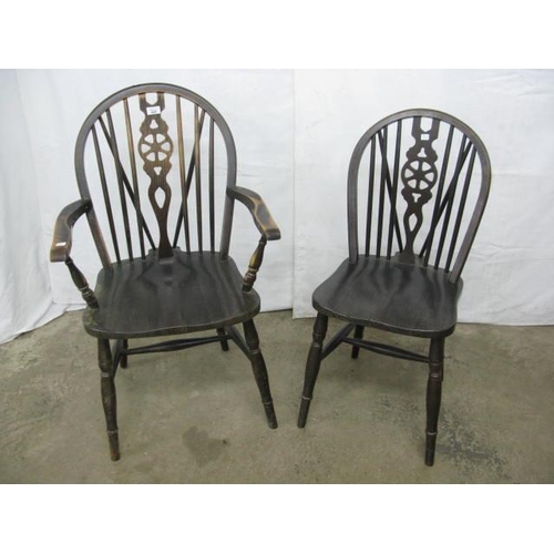 408 - Two stained beech wheelback chairs comprising one standard chair and one carver, both having hoop ba... 