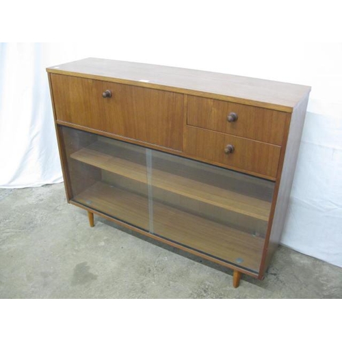 411 - Avalon teak glazed bureau bookcase having two drawers next to a fall front opening to four pigeon ho... 