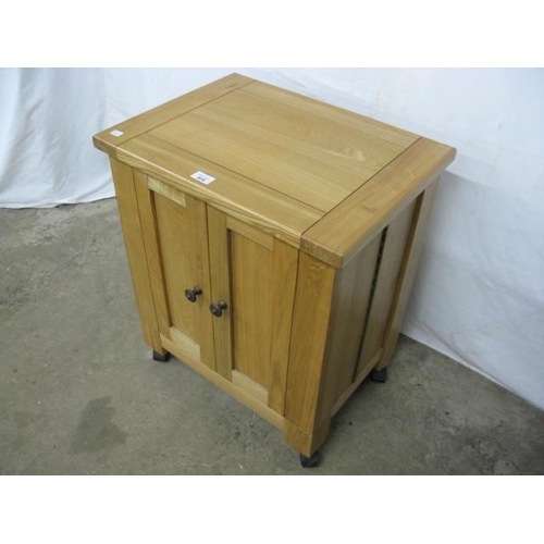 414 - Modern light oak cabinet having two panelled doors opening to open shelves on the reverse of each do... 