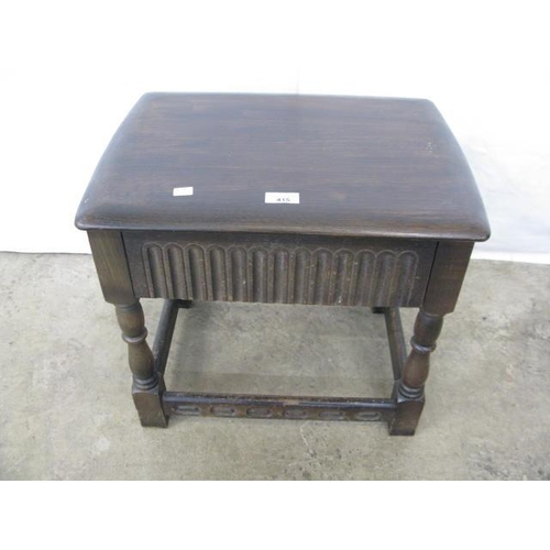 415 - Dark oak lamp table having a carved frieze drawer, standing on baluster legs with stretchers - 50cm ... 