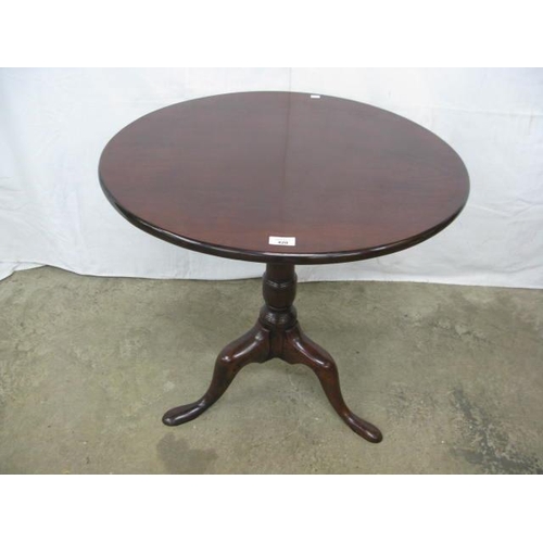 420 - Mahogany tilt top table, the circular top standing on a turned column with splayed tripod supports -... 