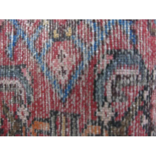 458 - Hamadan red ground patterned runner having a central lozenge design flanked by repeating geometric p... 