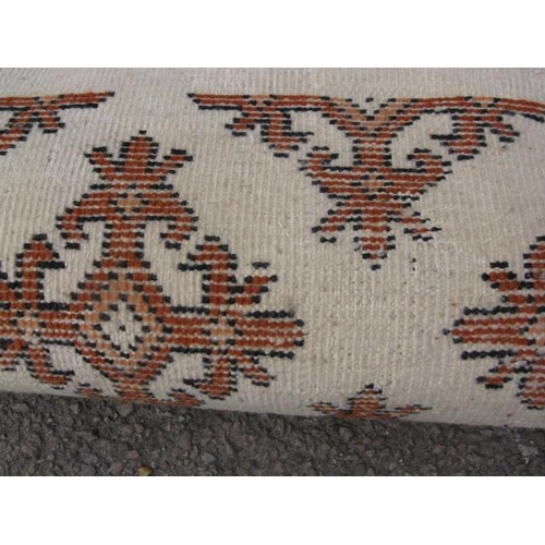 483 - Pair of Tunisian cream and orange ground patterned rugs both having a repeating geometric pattern an... 