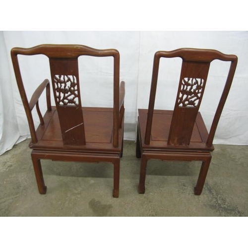 491 - Two hardwood Chinese dining chairs comprising one carver and one standard, both having carved pierce... 