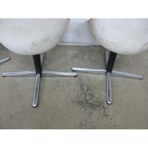 493 - Set of four Centa swivel dining chairs having padded leatherette seats and backs, standing on metal,... 