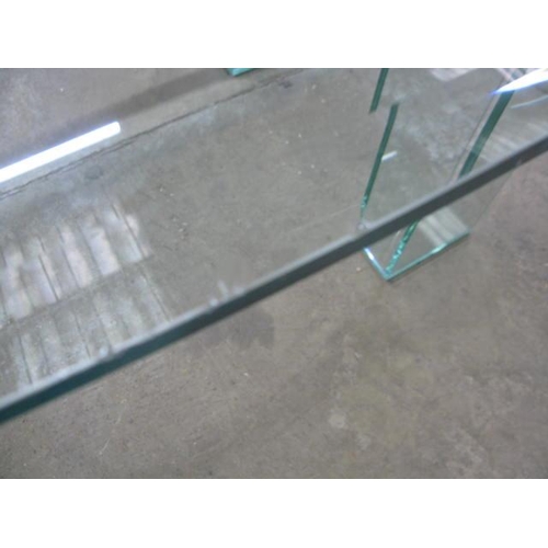 526 - Oval glass top dining table standing on two glass supports - 245cm x 108cm x 74cm tall (chips to edg... 