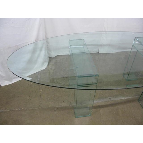 526 - Oval glass top dining table standing on two glass supports - 245cm x 108cm x 74cm tall (chips to edg... 