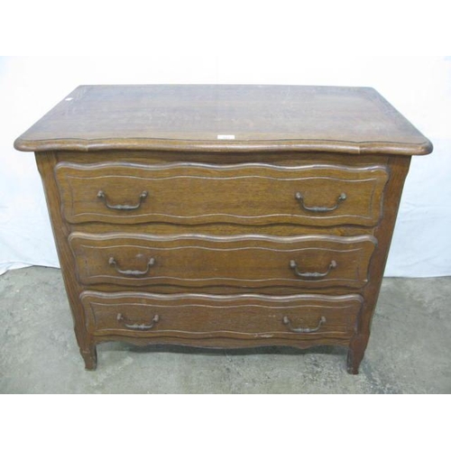 503 - Continental style oak chest of three drawers with serpentine top, standing on shaped legs - 99cm x 5... 