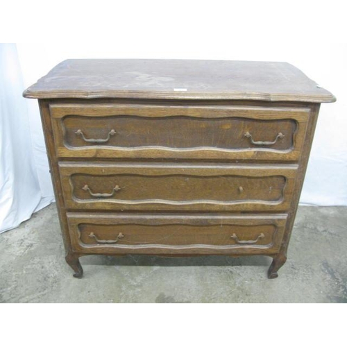 504 - Continental style oak chest of three drawers with shaped top, standing on shaped legs - 100cm x 49cm... 