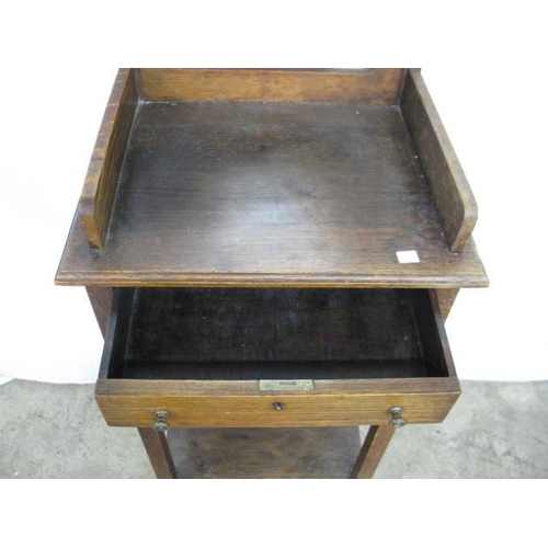 507 - Oak shaving stand having a shield shaped mirror over a three quarter galleried top with a single dra... 