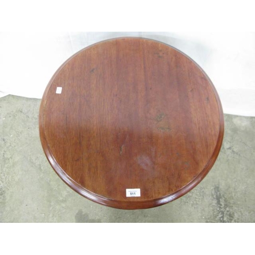 511 - Stained wood top pub table, the circular top standing on a tubular metal column with pierced iron tr... 