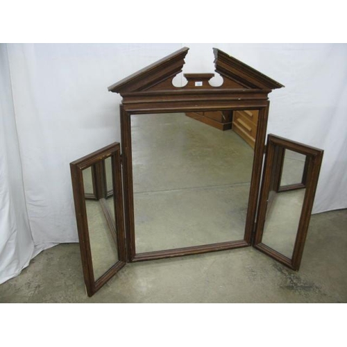 515 - Large triple mirror having a large central mirror with pediment top and two hinged rectangular side ... 