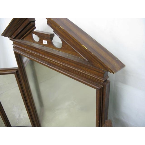 516 - Large triple mirror having a large central mirror with pediment top and two hinged rectangular side ... 