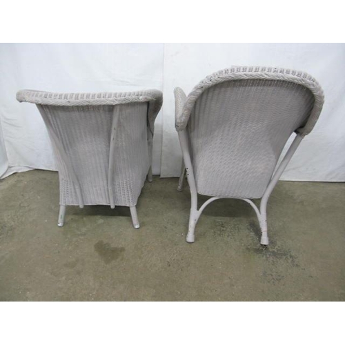 518 - Two painted Lloyd Loom chairs both having shaped backs and padded seats, standing on round tapering ... 