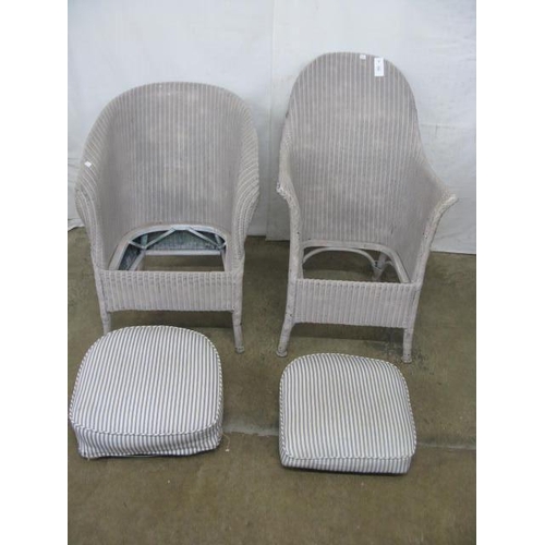 518 - Two painted Lloyd Loom chairs both having shaped backs and padded seats, standing on round tapering ... 