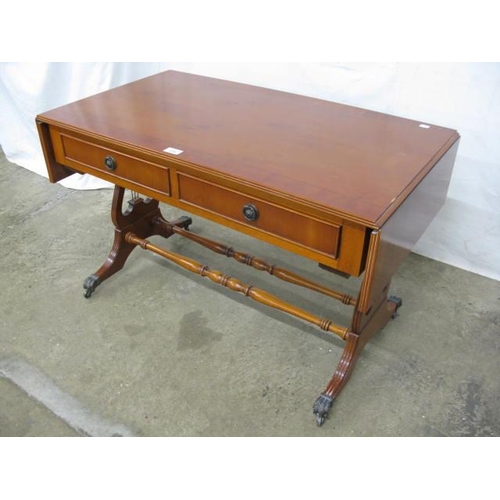 519 - Inlaid cross banded yew wood sofa table having two drawers with faux drawer fronts to reverse, stand... 