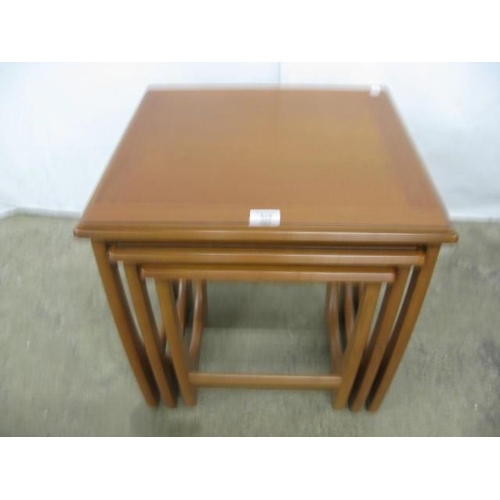 525 - G-Plan teak next of three Astro style tables, all standing on shaped end supports - largest 50cm x 5... 