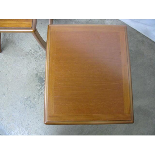 525 - G-Plan teak next of three Astro style tables, all standing on shaped end supports - largest 50cm x 5... 