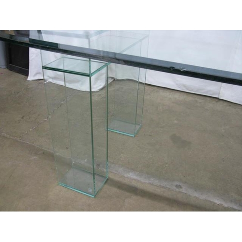 526 - Oval glass top dining table standing on two glass supports - 245cm x 108cm x 74cm tall (chips to edg... 