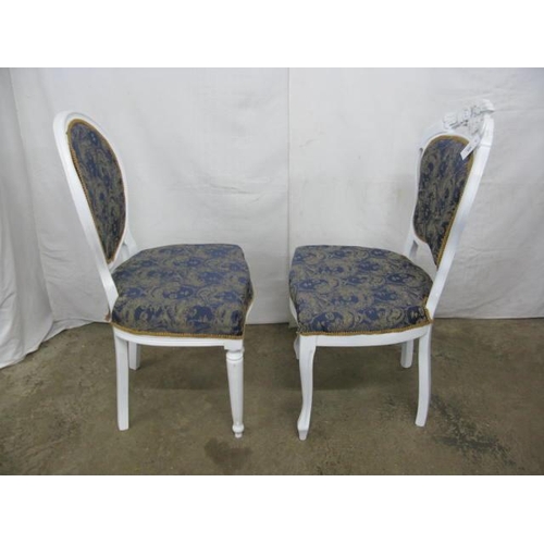 529 - White painted chair having carved cresting rail, padded back and seat, standing on cabriole front le... 