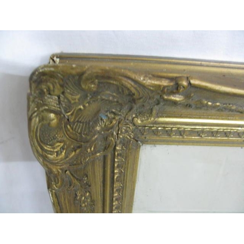 533 - Ornate gilt and black bevelled edge mirror - 84cm x 5cm x 116cm together with an ornate gilt bevelle... 