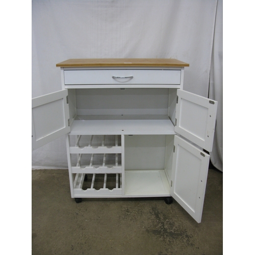 398 - Modern white kitchen island with three cupboards, a single drawer and a wine rack having pine top an... 