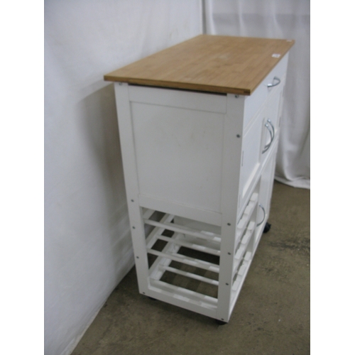 398 - Modern white kitchen island with three cupboards, a single drawer and a wine rack having pine top an... 