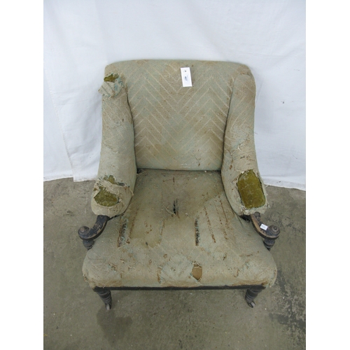 407 - 19th century armchair having padded and scrolled armrests supported on turned and tapering front leg... 