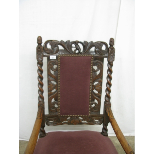 414 - Charles II walnut open armchair having padded back surmounted with putti and foliate carved framewor... 