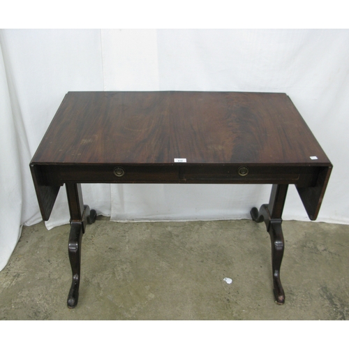 418 - Mahogany sofa table, the rectangular top with drop flap to each side having rounded corners over two... 