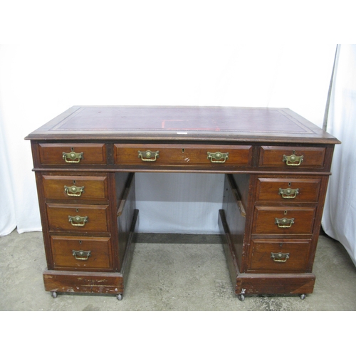 420 - Mahogany twin pedestal desk having a red leather gilt tooled insert over three frieze drawers, stand... 