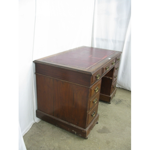 420 - Mahogany twin pedestal desk having a red leather gilt tooled insert over three frieze drawers, stand... 