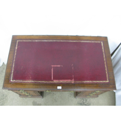 420 - Mahogany twin pedestal desk having a red leather gilt tooled insert over three frieze drawers, stand... 
