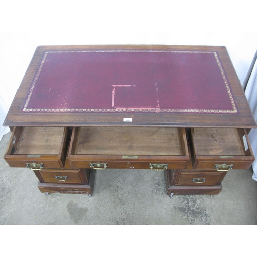 420 - Mahogany twin pedestal desk having a red leather gilt tooled insert over three frieze drawers, stand... 