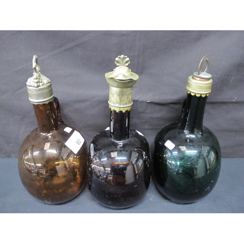 82 - Three coloured glass flagons, two with metal stoppers and collars and one with a metal collar and po... 