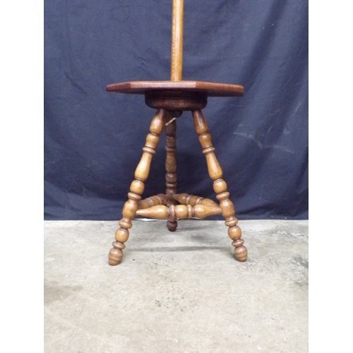 248 - Oak arts and crafts standard lamp, having turned column leading to a gypsy style table base, support... 