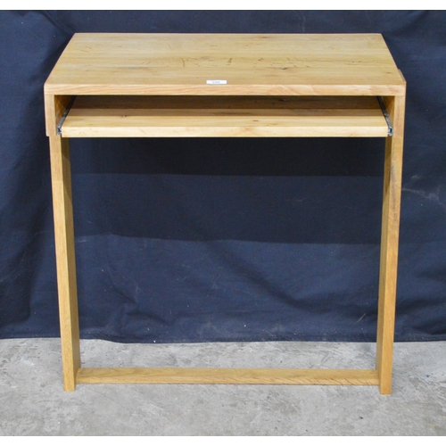256 - Light oak wall mounted writing table, having pull slide supported on stretchered moulded uprights - ... 