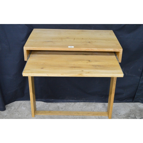 256 - Light oak wall mounted writing table, having pull slide supported on stretchered moulded uprights - ... 