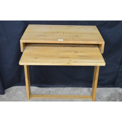 256 - Light oak wall mounted writing table, having pull slide supported on stretchered moulded uprights - ... 