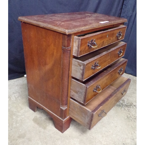 262 - Mahogany chest of four long graduated drawers with brass handles, standing on bracket feet - 72cm x ... 