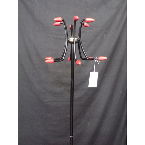 277 - Mid century metal coat/hat stand, having six coat and hat hooks with plastic terminals, supported on... 