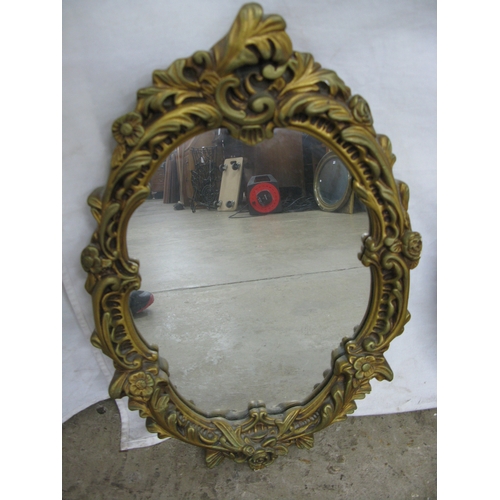 241 - Group of three gilt framed mirrors to comprise: ornate oval gilt framed mirror - 37cm x 57cm, convex... 