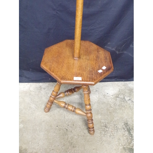 248 - Oak arts and crafts standard lamp, having turned column leading to a gypsy style table base, support... 