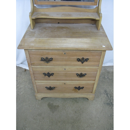 249 - Satinwood dressing chest having a moulded top bevel edge mirror over a bow fronted shelf above three... 