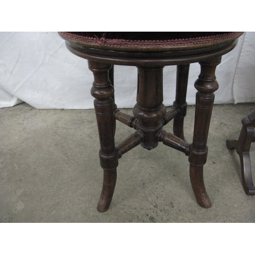 265 - Victorian walnut revolving piano seat having a circular padded seat and standing on turned splayed s... 