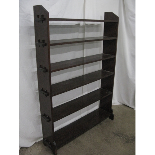 275 - Oak open bookshelves having six peg and hole shelves united by shaped end supports - 106cm x 27cm x ... 