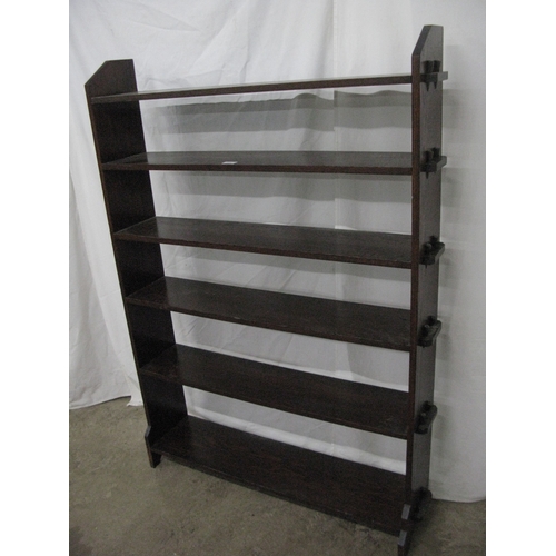 275 - Oak open bookshelves having six peg and hole shelves united by shaped end supports - 106cm x 27cm x ... 